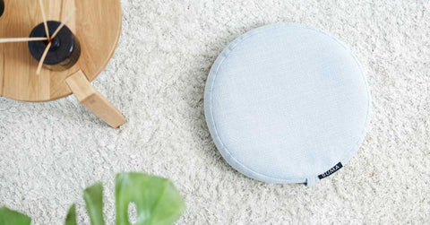 SUMA Classic meditation cushion on warm wooden floor
