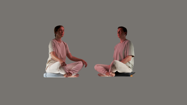 Couple practicing mindfulness meditation together on SUMA cushions