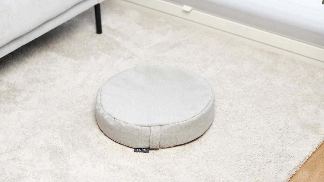 SUMA Classic meditation cushion in a minimalist chair-free living room